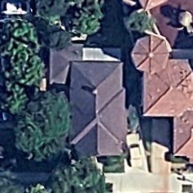 Aerial photograph of a house in Santa Ana, California with trees over the roof.